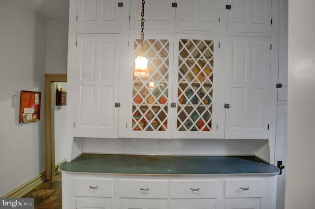 144 W Main St, Waynesboro, PA 17268 - kitchen featuring baseboards, white cabinetry, and dark countertops