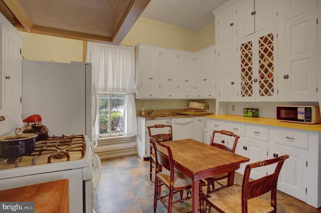 144 W Main St, Waynesboro, PA 17268 - kitchen featuring white appliances, white cabinets, light countertops, and a sink