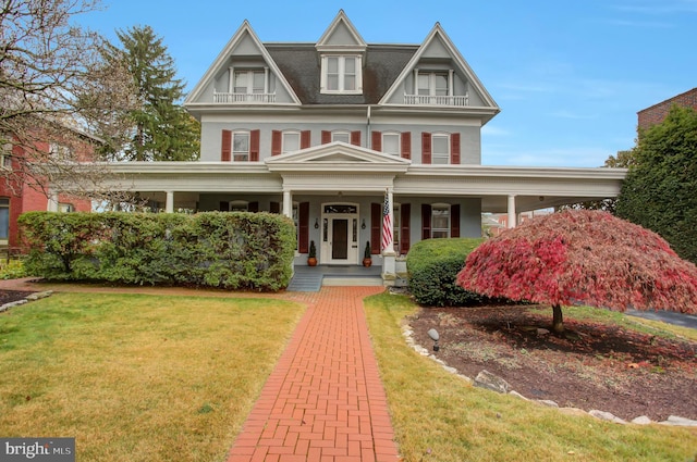 144 W Main St, Waynesboro, PA 17268 - view of front of house featuring a porch and a front lawn