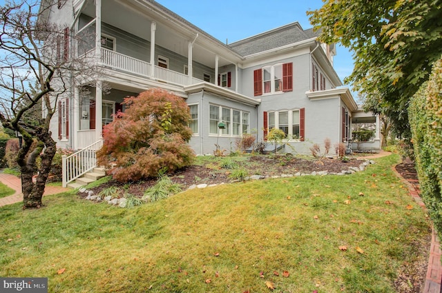 144 W Main St, Waynesboro, PA 17268 - view of side of home with a yard and a balcony