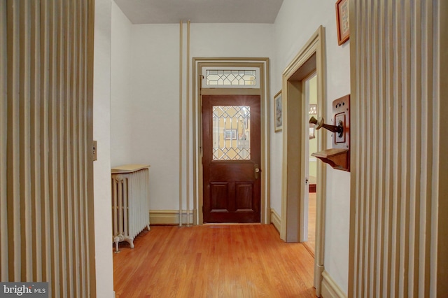 144 W Main St, Waynesboro, PA 17268 - entryway with radiator heating unit, light wood-style floors, and baseboards