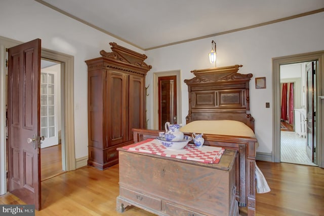 144 W Main St, Waynesboro, PA 17268 - bedroom with light wood finished floors, crown molding, and baseboards