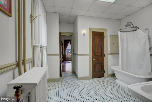 144 W Main St, Waynesboro, PA 17268 - full bathroom featuring a paneled ceiling, tile patterned floors, a bathtub, a shower with curtain, and baseboards