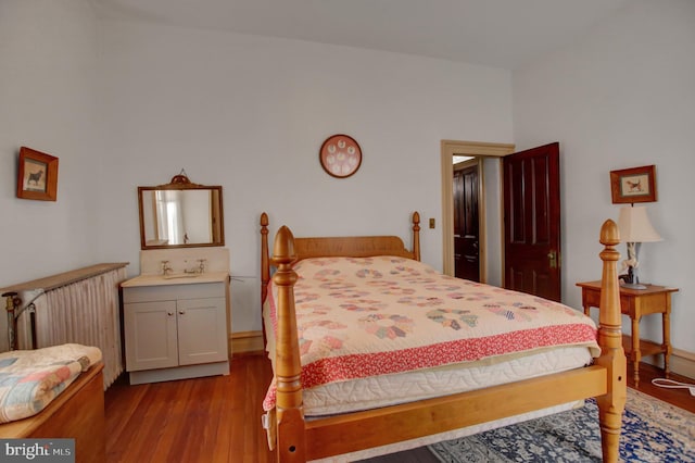 144 W Main St, Waynesboro, PA 17268 - bedroom featuring wood finished floors, vaulted ceiling, and baseboards