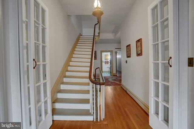 144 W Main St, Waynesboro, PA 17268 - stairway with french doors and wood finished floors