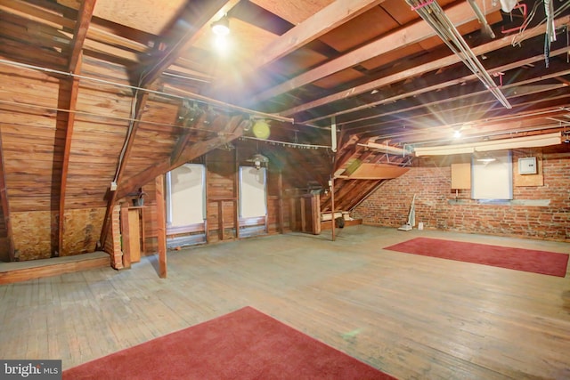144 W Main St, Waynesboro, PA 17268 - unfinished below grade area with hardwood / wood-style flooring and brick wall