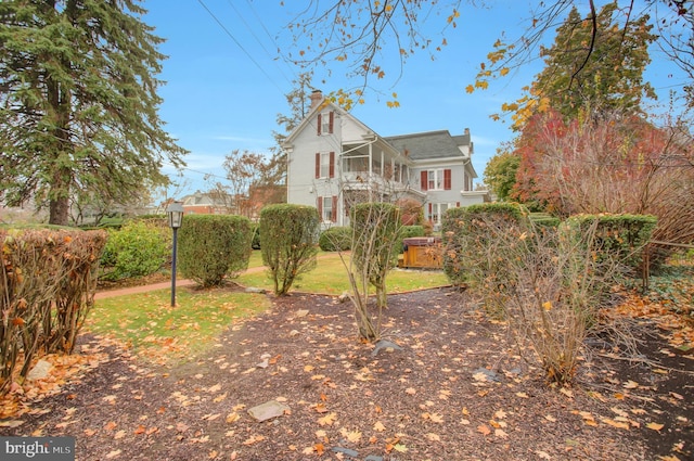 144 W Main St, Waynesboro, PA 17268 - view of home's exterior with a chimney and a sunroom