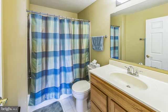 bathroom featuring a shower with curtain, tile patterned flooring, vanity, and toilet