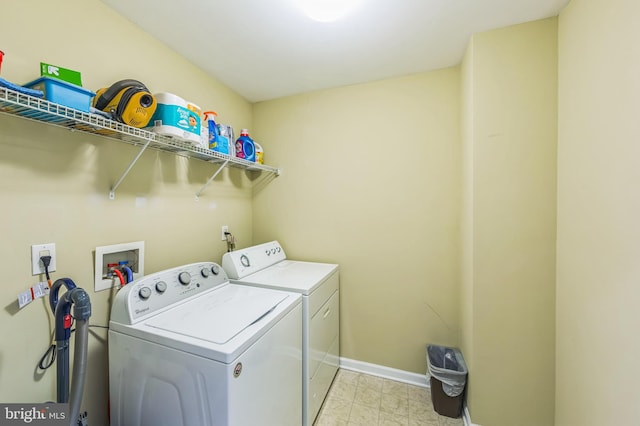 washroom with washing machine and dryer