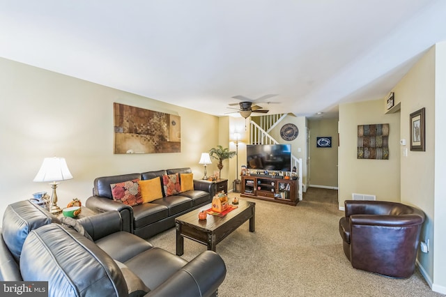 carpeted living room featuring ceiling fan