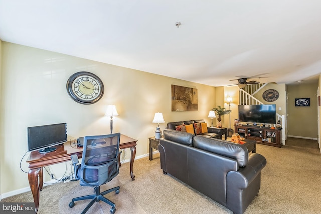 living room featuring ceiling fan and light carpet