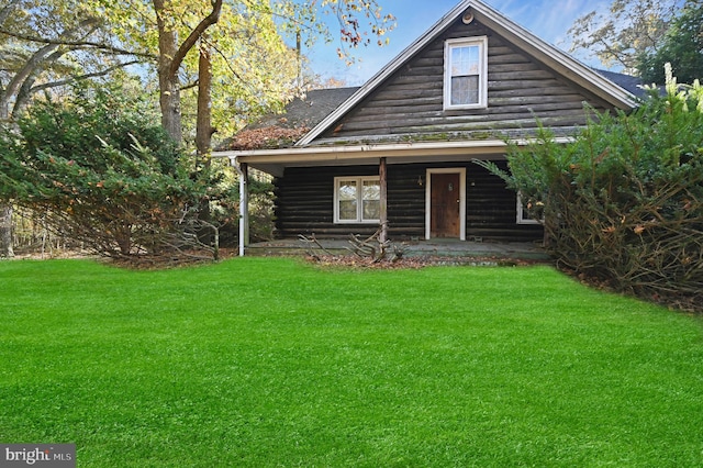 log-style house with a front yard