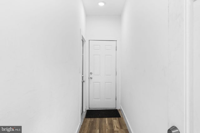 hallway featuring dark wood-type flooring