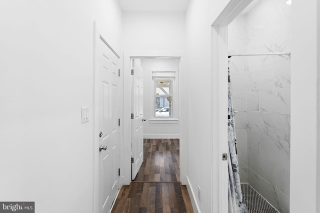 hallway featuring dark hardwood / wood-style flooring