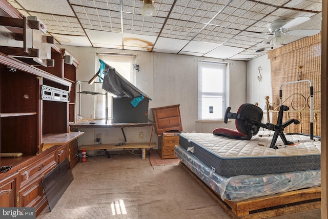 carpeted bedroom featuring a paneled ceiling