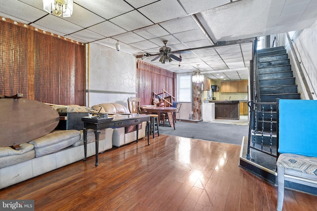 living room with hardwood / wood-style floors, rail lighting, and ceiling fan