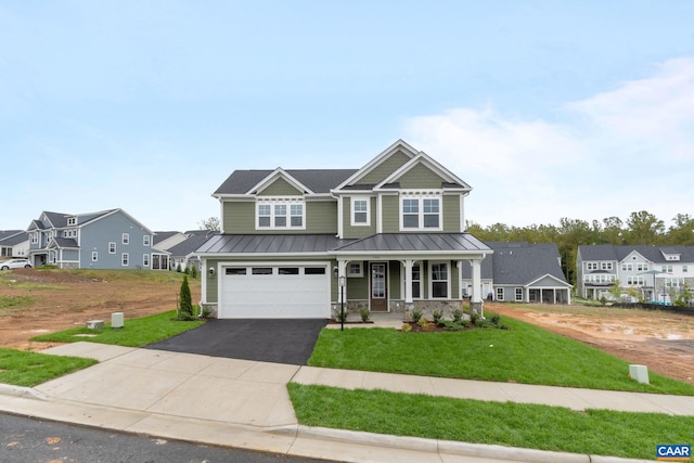 craftsman-style home featuring a porch, a front yard, and a garage