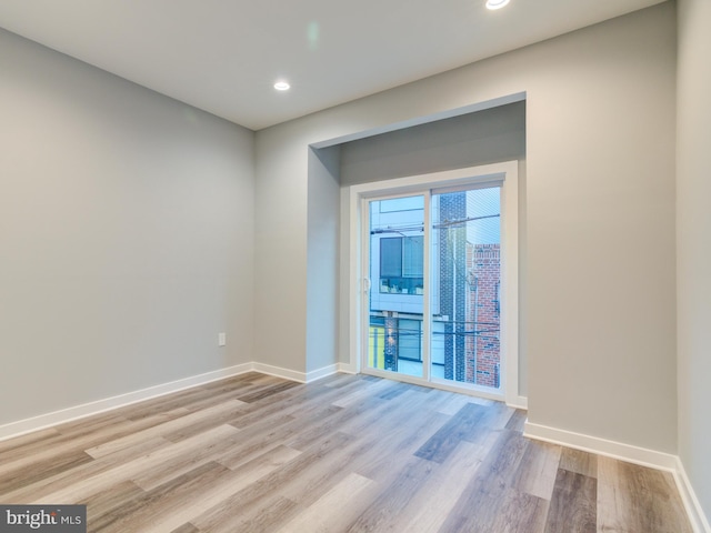 unfurnished room featuring light hardwood / wood-style floors