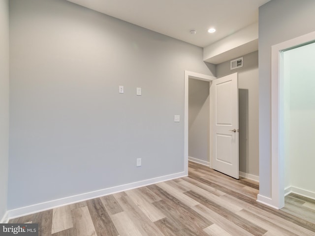 unfurnished room featuring light hardwood / wood-style flooring