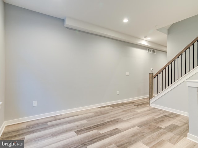 basement featuring light hardwood / wood-style floors