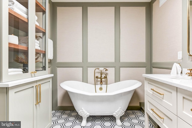 bathroom featuring a washtub, vanity, and tile patterned floors