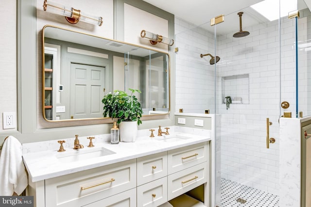 bathroom featuring walk in shower and vanity