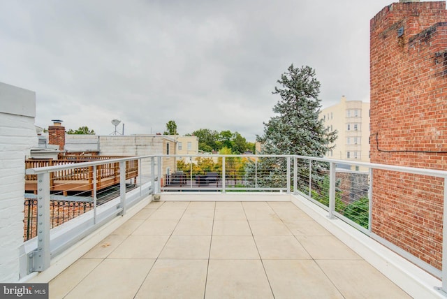 view of patio with a balcony