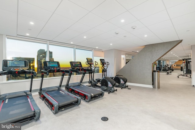 workout area featuring a drop ceiling