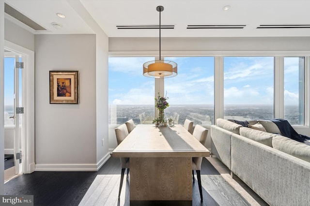 dining room with dark hardwood / wood-style floors