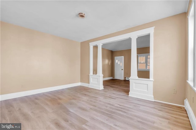 empty room with light hardwood / wood-style floors