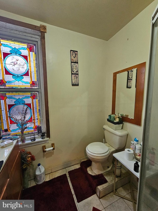 bathroom with tile patterned flooring and toilet