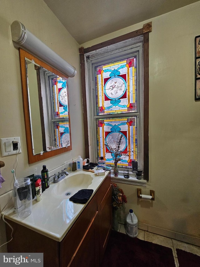 bathroom featuring tile patterned floors and vanity