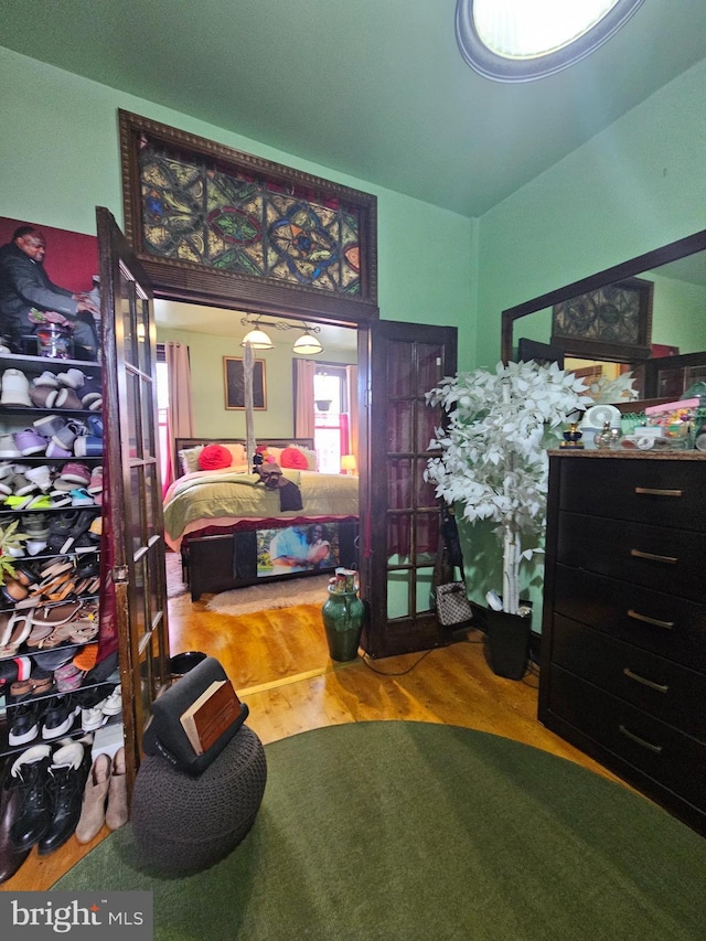 bedroom with hardwood / wood-style floors