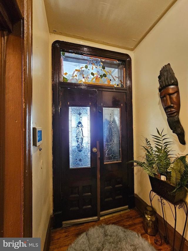 entryway with french doors and dark hardwood / wood-style floors