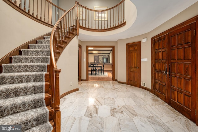 foyer entrance featuring a high ceiling