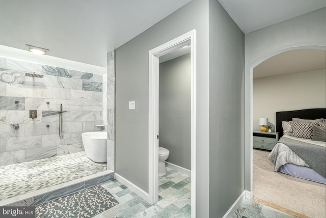 bathroom with toilet and separate shower and tub