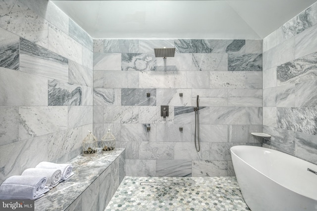 bathroom featuring tile walls and shower with separate bathtub