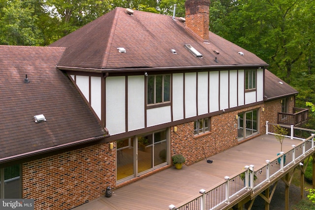 rear view of house with a deck