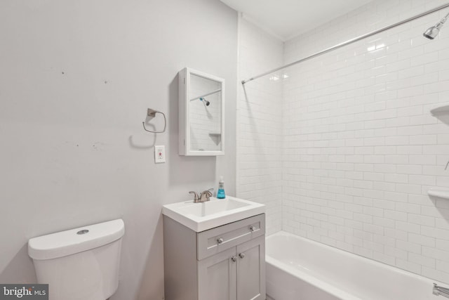 full bathroom with vanity, toilet, and tiled shower / bath