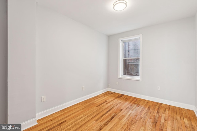 empty room featuring hardwood / wood-style flooring