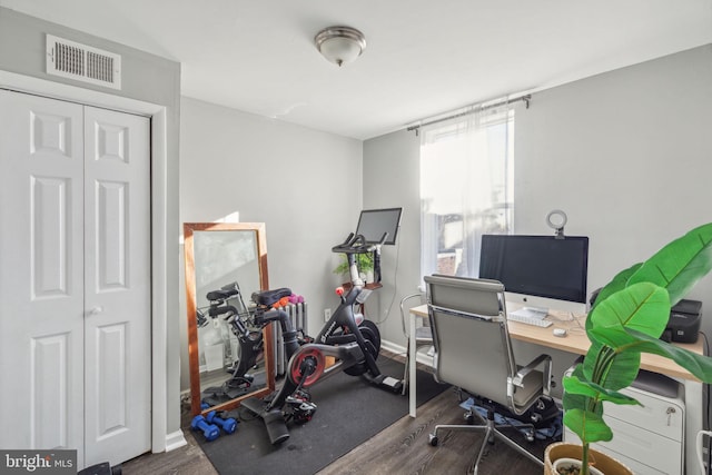 office space with dark hardwood / wood-style floors