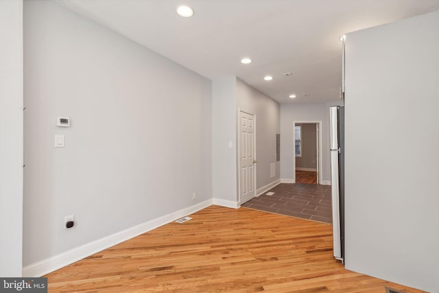 hallway featuring hardwood / wood-style flooring