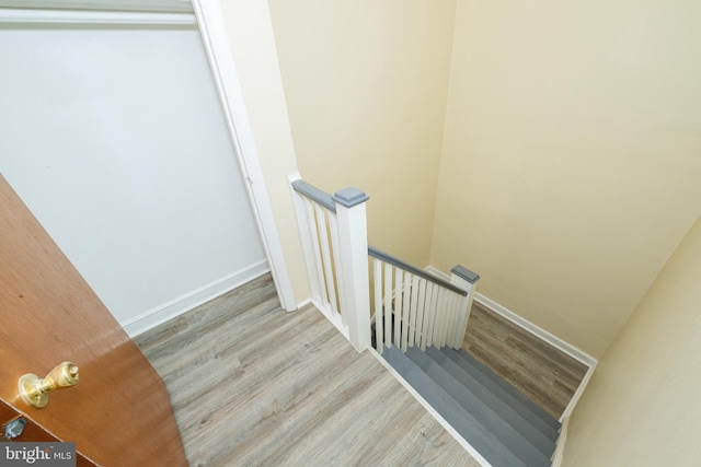 staircase featuring hardwood / wood-style flooring