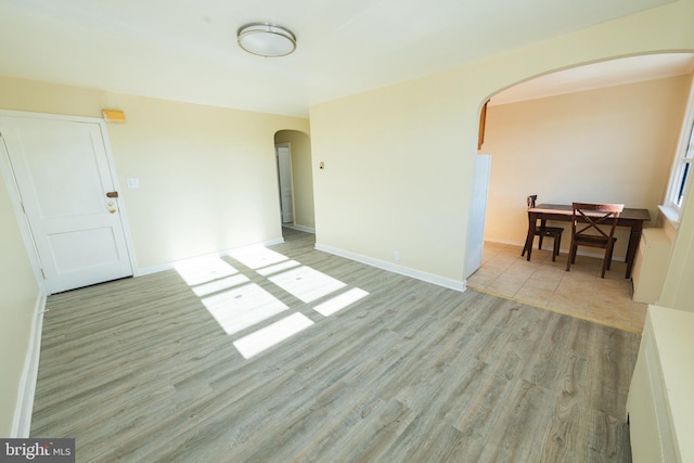 spare room with light hardwood / wood-style floors