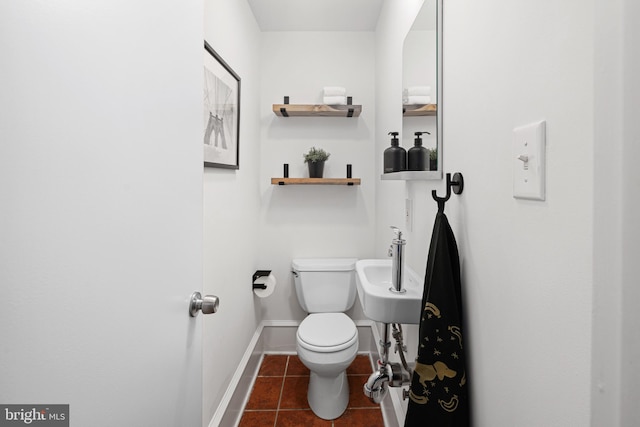 bathroom with tile patterned floors and toilet