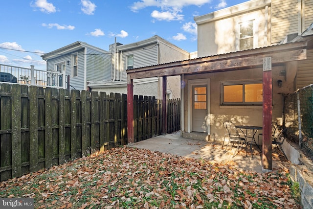 rear view of property featuring a patio