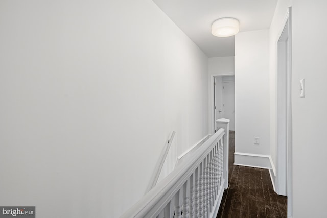 corridor with dark wood-type flooring