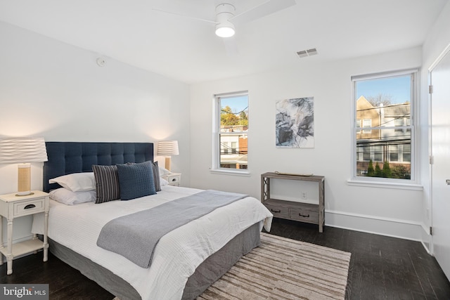 bedroom featuring ceiling fan and dark wood-type flooring