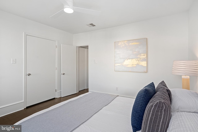 bedroom featuring ceiling fan and dark hardwood / wood-style floors