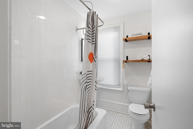 bathroom featuring tile patterned flooring, shower / bath combo, and toilet